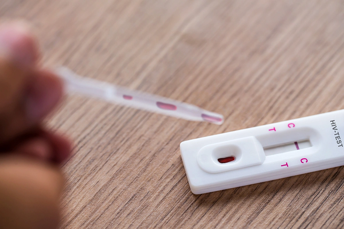 A patient using a HIV rapid test kit