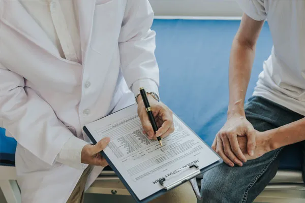 A doctor discussing erectile dysfunction care with a patient