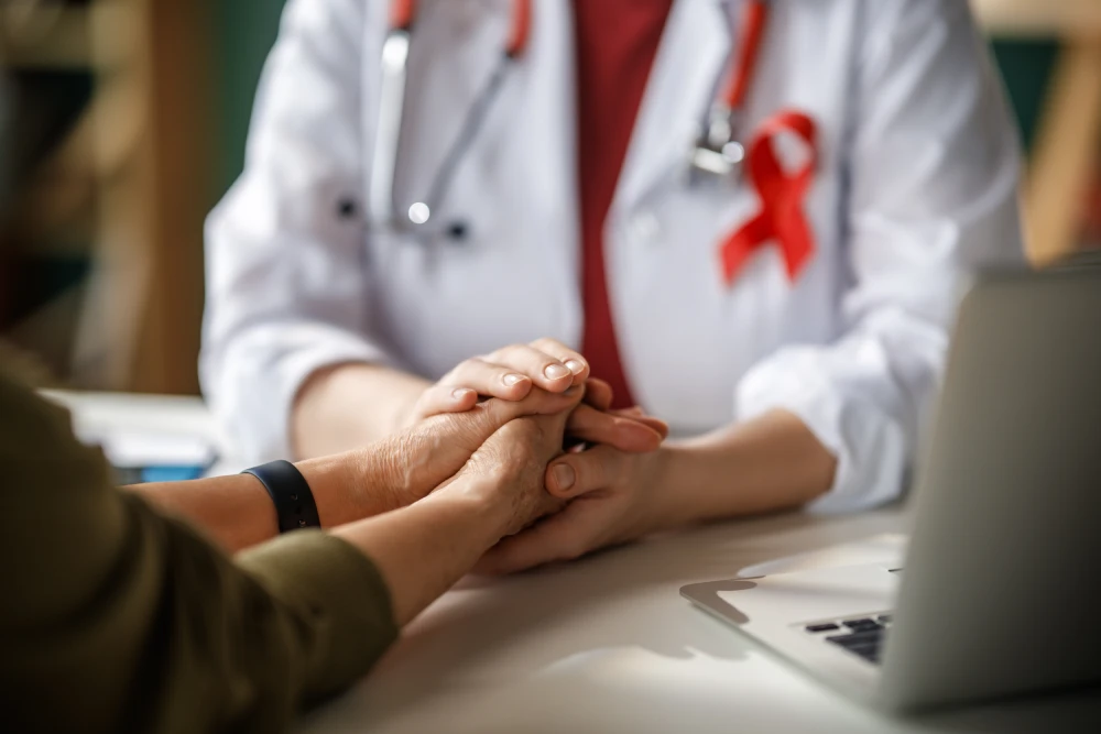 A doctor at an HIV clinic providing support to a patient.