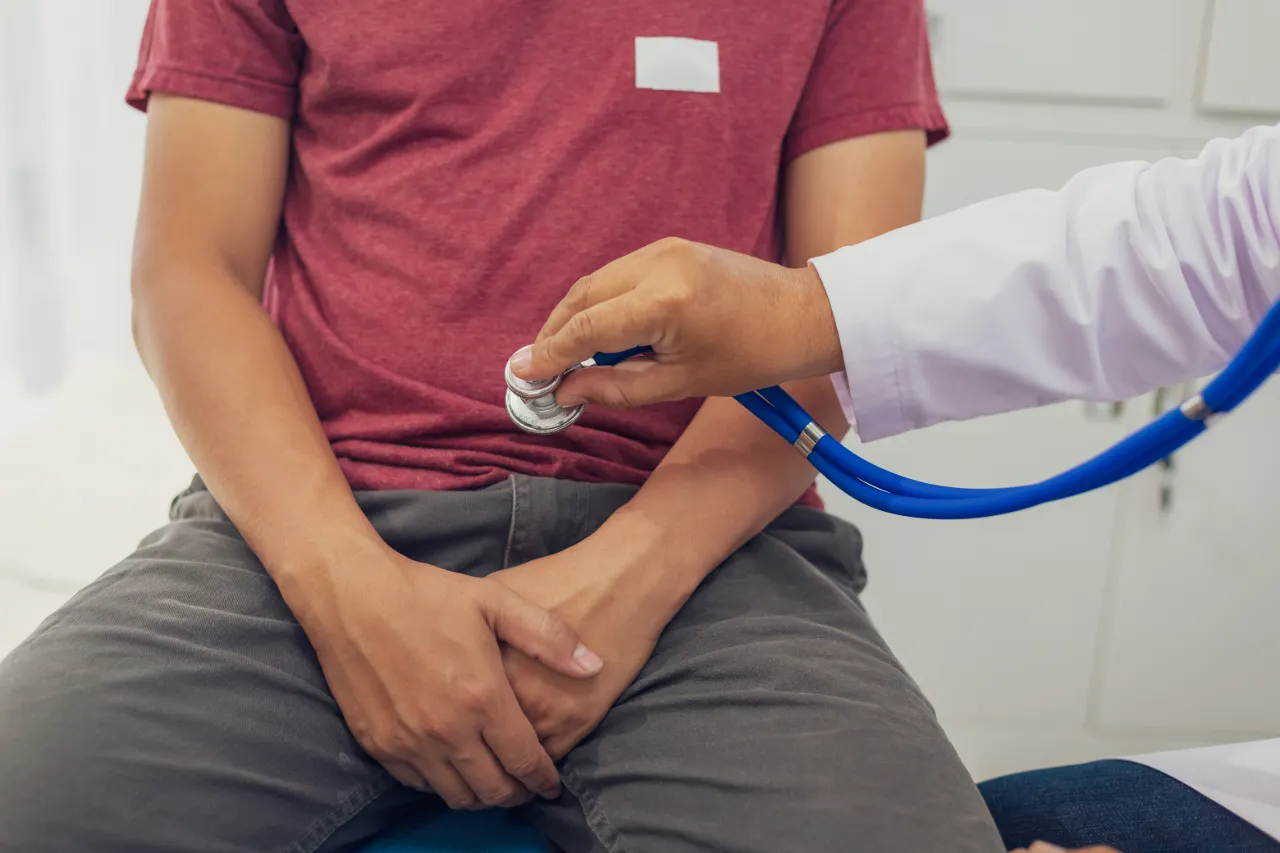 A doctor carrying out an assessment at a men’s health clinic