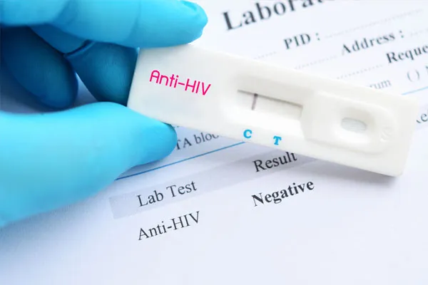 A doctor holding a negative STD test kit