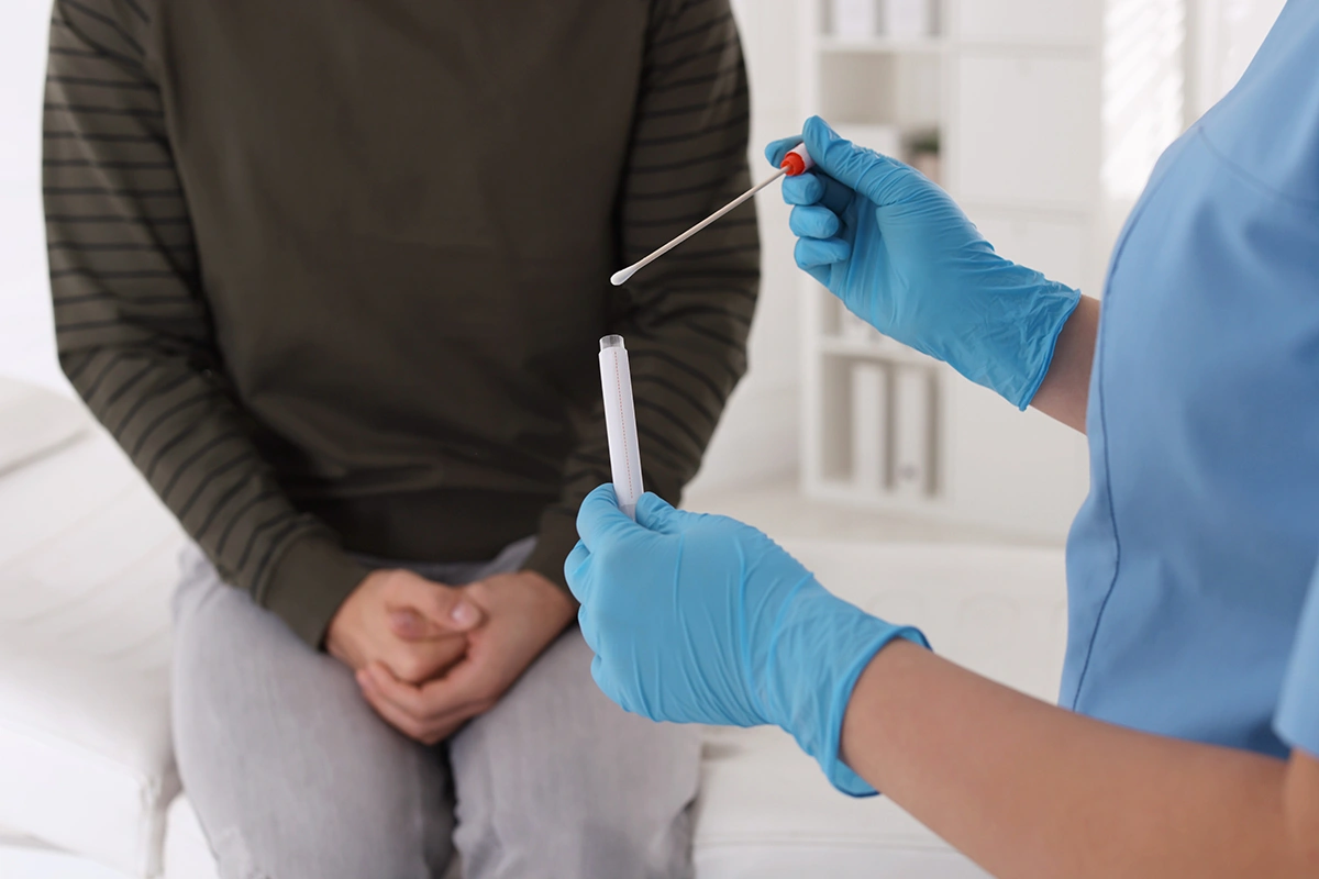 A man undergoing an STD test at a men’s sexual health clinic